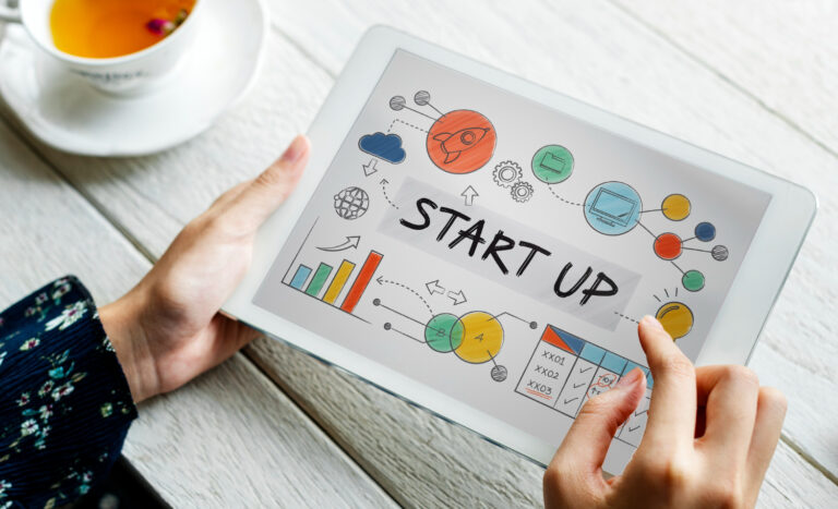 Startup business concept displayed on a tablet, featuring graphs and charts to illustrate growth and innovation.